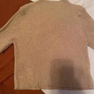 Great for the holidays!! Never worn, without tags short turtleneck sweater